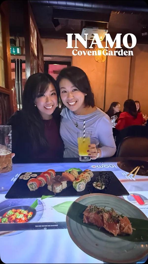 The video showcases a dinner experience at Inamo, a restaurant in Covent Garden, London. It highlights the unique feature of interactive tables where customers can order food, change the virtual tablecloth, and play games. The video features two women enjoying a variety of Pan-Asian dishes, including sushi rolls, sashimi, bao buns, Korean BBQ chicken ribs, and scallops. The overall atmosphere is presented as fun, modern, and suitable for a social outing.