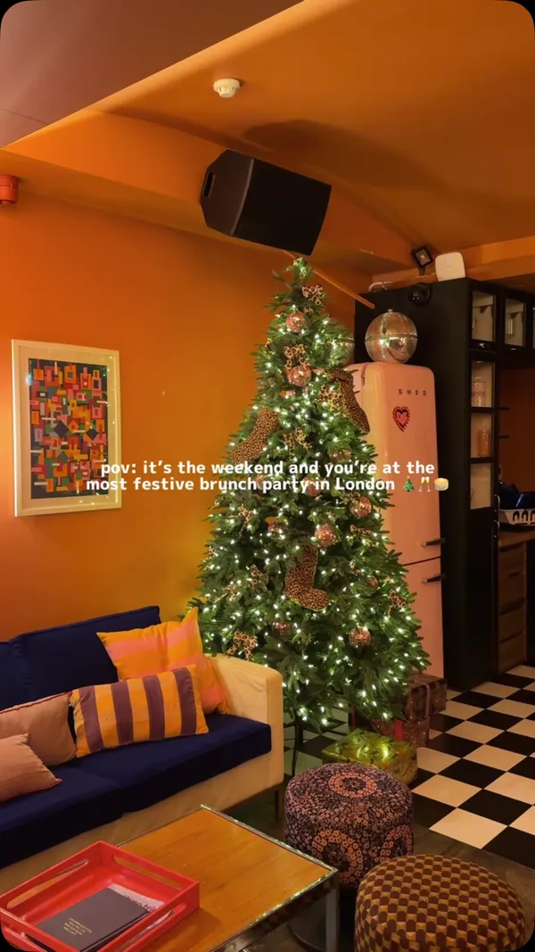 This video showcases The Little Violet Door, a bar in Carnaby with a Christmas theme.  It features festive cocktails, brunch food (pancakes with various toppings, bacon), and a tour of the venue's interior including a uniquely decorated bathroom. The overall tone is celebratory and upbeat.