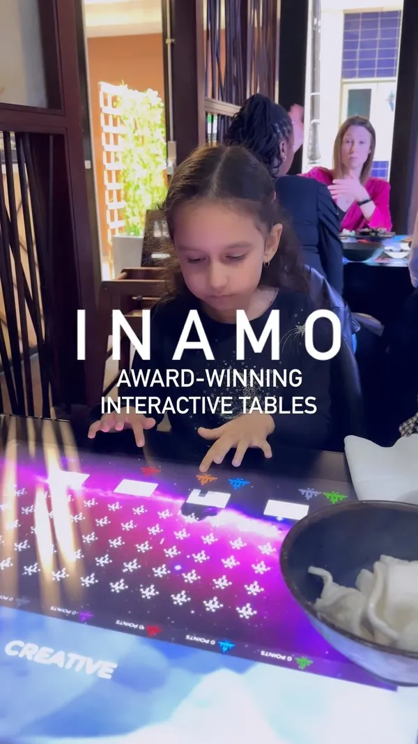 This video showcases Inamo, a restaurant in Covent Garden, London, known for its interactive touch-sensitive dining tables. The video highlights various dishes from the menu, including Shishito peppers, Miso Aubergine, different types of sushi rolls (New York, Samurai, Tiger), Chicken Karaage, Duck Ramen Noodle, Miso Soup, and prawn crackers.  The food is presented attractively, with several close-up shots.  While specific dietary information isn't explicitly stated, the video shows dishes that may be suitable for various dietary needs. The main focus is the dining experience and the variety of food available.