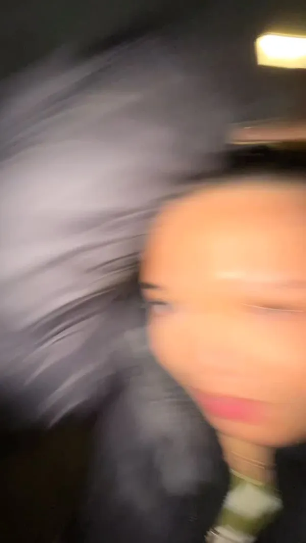 The video begins with a woman vlogging at night while walking on a bridge in London, with the city skyline in the background. She talks enthusiastically about the positive vibes and opportunities in the city. The scene then transitions to an indoor setting at the Inamo restaurant, located near Tower Bridge. The video showcases a variety of Asian dishes, including sushi rolls, bao buns, and seasoned fries with a sauce. It features shots of the full table spread with drinks and highlights the restaurant's view of Tower Bridge from the window. The video concludes with the creator and her friend toasting with sushi.