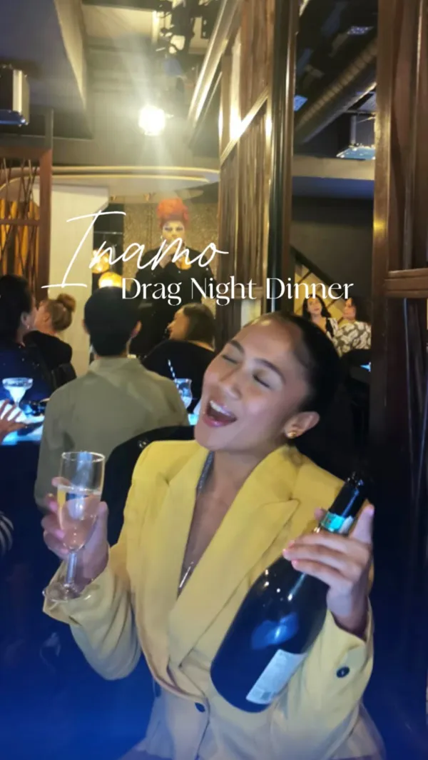 This video showcases Inamo restaurant in Covent Garden, London, which offers a drag night dinner.  The video highlights the restaurant's Pan-Asian cuisine, interactive tables with food ordering and games, and the drag queen performance. Specific dishes shown include gyozas (beef and chicken karaage), dragon roll with salmon tataki kimchi, fried rice with pork belly, and yuzu pork belly. The food is presented attractively on sleek, dark plates against a luminous blue table. No dietary information is explicitly given. The main focus is on creating an exciting and fun atmosphere around the food and the drag show, emphasizing the experience as a whole.