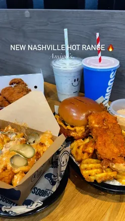 Spicy Nashville burger dishes and milkshake at Amigos Burgers in Acton, featuring HotBox meals and loaded fries.