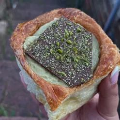 Delicious buns from home enjoyed by a family, featuring Dubai chocolate and vanilla custard desserts in London