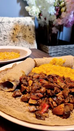 Plant-based Ethiopian dishes and stylish cafe interior at Lula's Ethiopian Cuisine in Oxford's covered market.