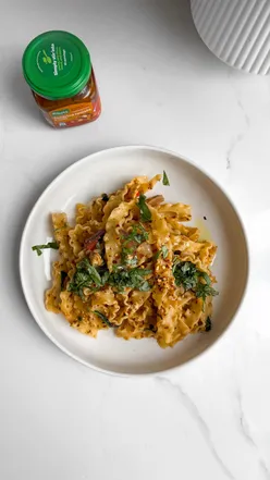Delicious sundried tomato pasta with veggies and tofu, made quickly with Knorr flavor paste - a simple vegan dish.