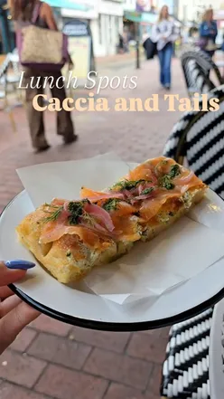 Delicious focaccia and blood orange doughnut at Caccia & Tails in Brighton, perfect for food lovers and people watching.