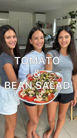 Fresh tomato and bean salad made with homegrown tomatoes, served with a homemade balsamic dressing.