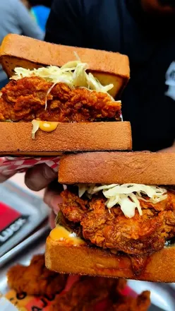 Delicious fried chicken sandwich from @mustbeluckys, enjoyed with a hilarious food adventure in London.