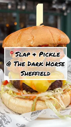 Vegan burger from SLAP & PICKLE at The Dark Horse in Sheffield, featuring messy flavors and delicious sides.