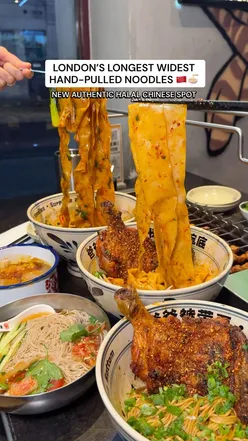 Guests enjoying authentic hand-pulled noodles at Belt Noodles, a vibrant Chinese restaurant in Central London.