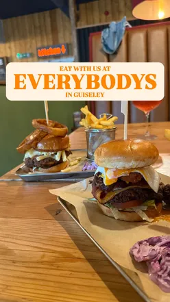 Guests enjoying the new burger menu at Everybodys in Guiseley, featuring the Artery Clogger and All Day Breakfast burgers.