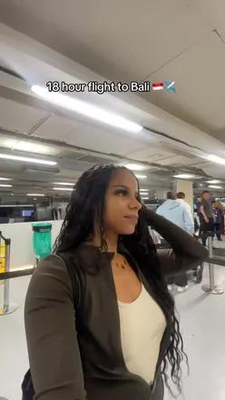 Travelers enjoying in-flight meals on a 24-hour journey to Bali with Ethiopian Airlines.