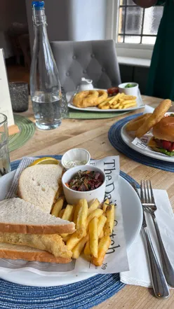 Cozy autumn scene at The Old Pheasant pub, showcasing delicious food and warm service in Leicester.