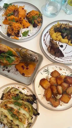 Delamina Townhouse showcasing vibrant Eastern Mediterranean sharing plates in London, including kubaneh and grilled lamb.
