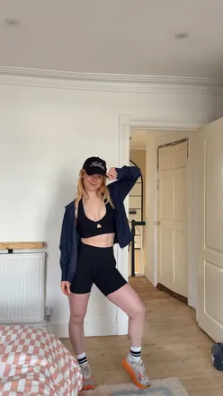 Runner in Fabletics gear hurrying down the street, embodying an active lifestyle.