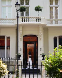 Elegant boutique hotel room at Grand Hotel Bellevue in London, steps from Paddington Station, exuding Parisian charm.