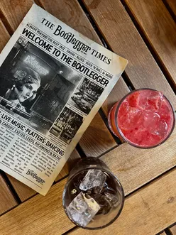 Enjoying creative cocktails at The Bootlegger, Cardiff, including Dirty Solero and Straw-barb Lemonade in a cozy setting.