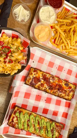 Delicious Detroit pizza slices and sides at The Dispensary in Newcastle from Dough Daze collaboration.