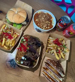 Delicious Egyptian street food from Masri, including Koshary, falafel burger, and ribeye kebab at Trinity Kitchen, Leeds.