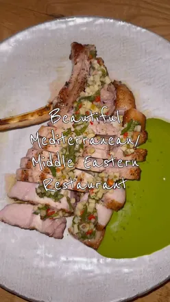 Interior of Clara London restaurant showcasing beautiful dishes perfect for sharing near the theatre district.