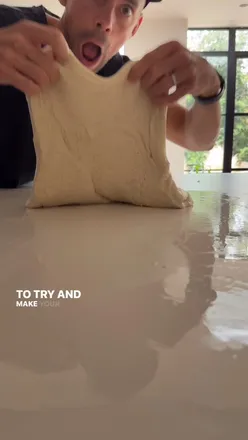 Freshly baked sourdough bread with pesto, showcasing a simple homemade recipe for perfect artisan baking.