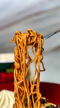 Bibigo Spicy Kimchi Ramyun with instructions and flavor rankings, showcasing delicious instant noodle options.