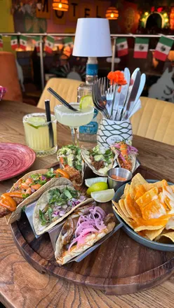 Enjoying colorful margaritas and flavorful tacos during a midweek date night at Motel Mexicana in Newcastle. 🌮🍹