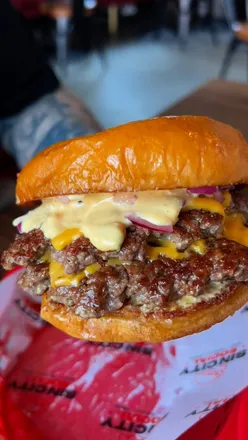 Delicious cheeseburger and indulgent shakes at Sin City Social in Liverpool, showcasing bold flavors and laid-back vibes.