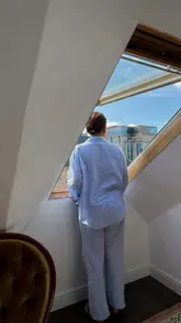 Person reflecting on the lucky moments of life, surrounded by everyday beauty and dreams of home.