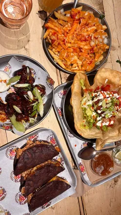 Delicious tacos and buffalo wings at Birria Brothers Tacos in Manchester, featuring fresh ingredients and bold flavors.