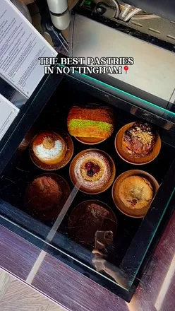 Pastries from Effy Stores in Nottingham, featuring a variety of delicious bakes like croissants and custard pies.