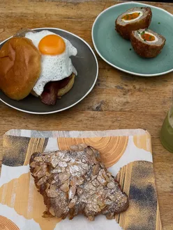 Breakfast at Wapping Wharf in Bristol: pastries from Mokoko Bakery and savory baps from Pigsty UK.