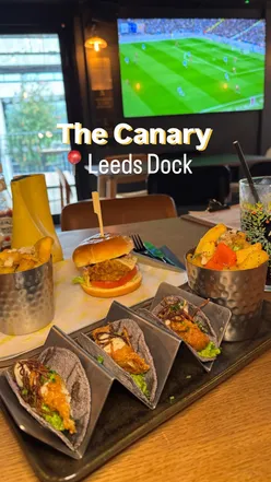 Fish tacos and chicken burger with fries at The Canary, Leeds Dock—perfect for game day dining and canal views!
