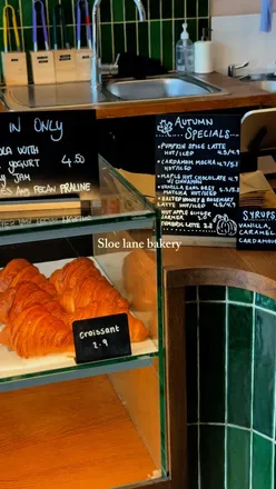 Flat white and pizza at Sloe Lane Bakery, Leith Walk, Edinburgh - a charming new spot with a cozy vibe.