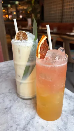 Delicious dishes at Rabble in Edinburgh, showcasing vibrant food offerings for £10 in a cozy bar atmosphere.