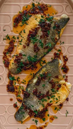 Delicious chilli and lemongrass sea bass dish featured in FANTASTIC FISH S3E2, inspired by Vietnamese cuisine.
