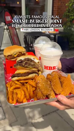 Customers enjoying halal smash burgers and milkshakes at HBR in Victoria, London, showcasing Kuwait's culinary influence.