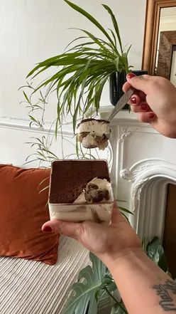 Delicious tiramisu at @_secretlayers in London, featuring creamy mascarpone and coffee-soaked sponge in elegant presentation.