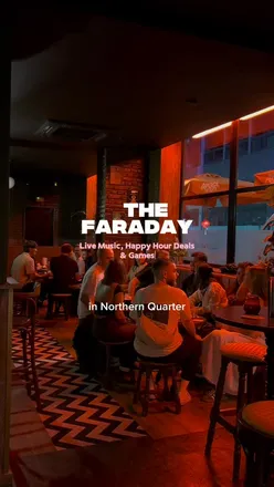 Group enjoying drinks at The Faraday pub in Northern Quarter, Manchester, with live music and happy hour specials.