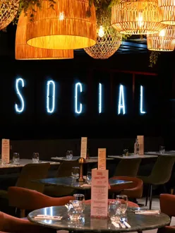 Group enjoying Neapolitan pizza at Social by Matto in Edinburgh on a casual date night.