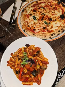 Collage of recent food highlights in London, featuring pizza, gelato, scones, bubble tea, and festive birthday bakes.