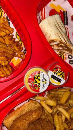 Guests enjoy delicious dishes at the launch of Lucky B Hot Chicken's new West End location in Glasgow.