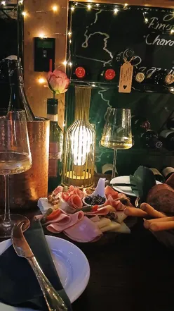 Cozy date night at Brooks Mews Wine House, featuring over 150 wines and decadent charcuterie near Oxford Street.