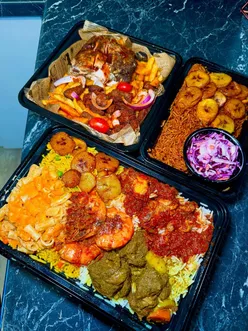 Delicious Afro-fusion dishes at Crave Kitchen in Leeds, featuring curry goat, jerk chicken, and flavorful sides.