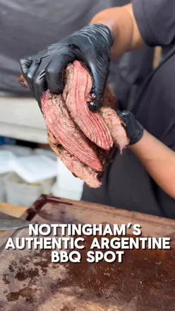 Delicious Argentinian BBQ dishes at Banquet 1415 in Nottingham, featuring milanesa, empanadas, and grilled beef with fries.