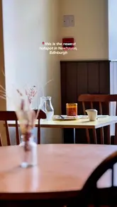 Couple enjoying shared plates at Norah restaurant in Newhaven, featuring locally sourced ingredients and stunning décor.