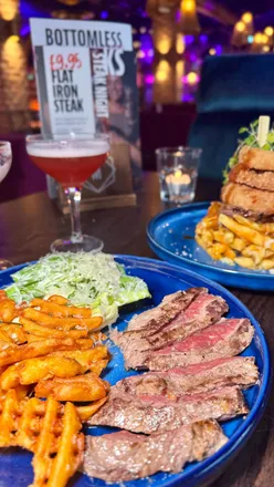 “Flat Iron steak, crispy fries, and mini Caesar salad at Manahatta Nottingham for just £9.95 during Steak Night!”