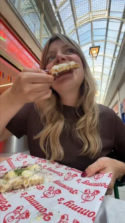 Pizza from the Boujee Foodie x Pommy's collaboration, launching October-November, showcased with excitement.