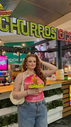 Delicious churros enjoyed during a shopping break at Manchester Arndale, radiating crispy, golden happiness.