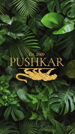 Dining at Pushkar in Birmingham, enjoying vibrant Indian cuisine with stunning cocktails and a delightful dessert platter.